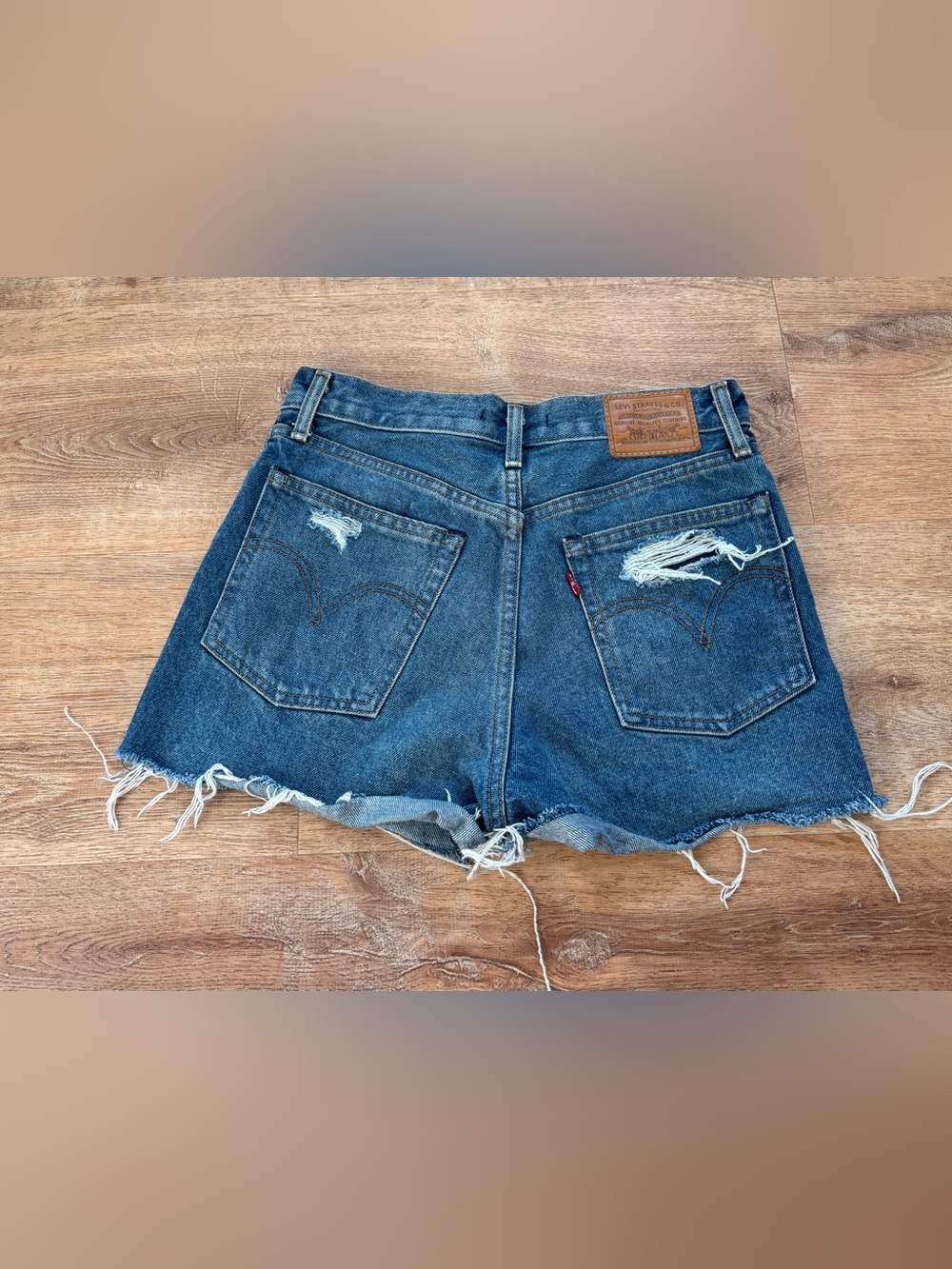 Levi's Women's Distressed Denim Cutoff Shorts in Dark Blue